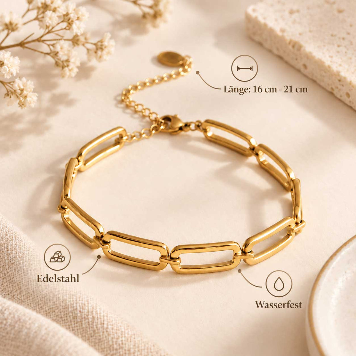 Maßbild des goldenen Gliederarmbands aus Edelstahl mit eingezeichneter verstellbarer Länge von 16 bis 21 cm
